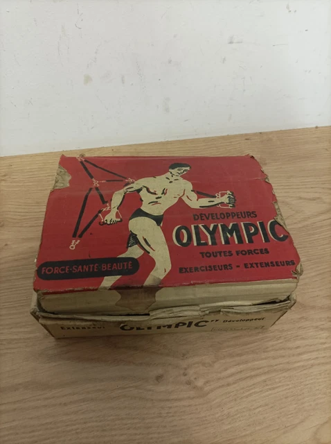 ancien appareil extenseur musculation avec sa boite olympic