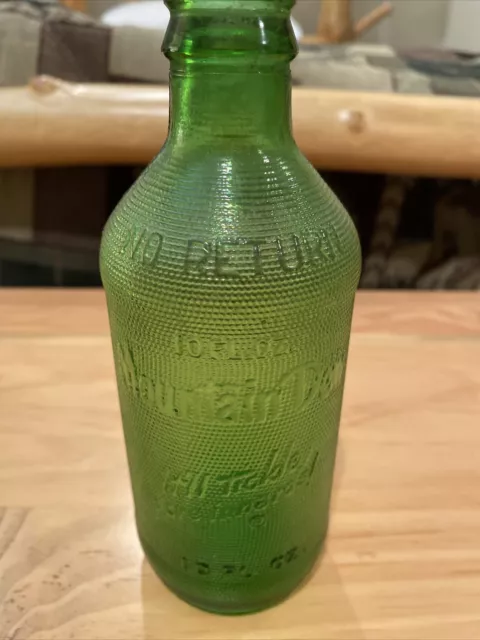 https://www.picclickimg.com/ZFIAAOSwnVVky8oN/Vintage-Rare-Green-Embossed-Mountain-Dew-Bottle-Itll.webp