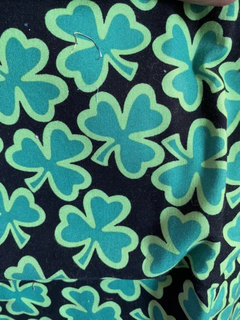 Black with green shamrocks  cotton  fabric 42 wide  by 1.39 yds (48")