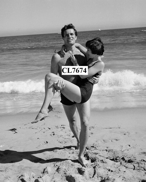 Hugh O'Brian Carries Natalie Wood During the Thalians Beach Ball in Malibu Photo Hugh O'Brian Carries Natalie Wood During the Thalians Beach Ball in Malibu Photo