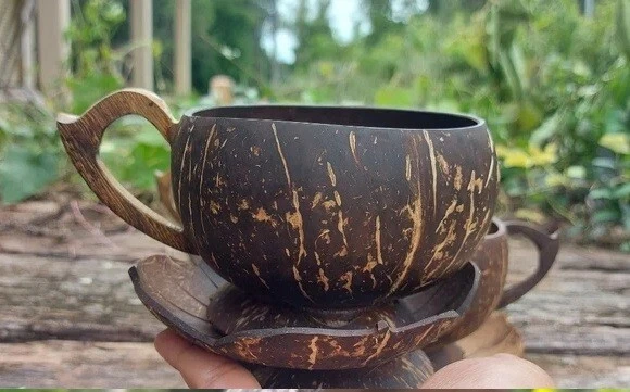 Handmade Coconut mug made from coconut shell being natural item Eco