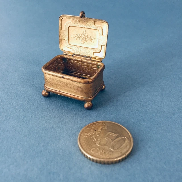 A miniature Mignonette all-bisque doll in original clothes, French