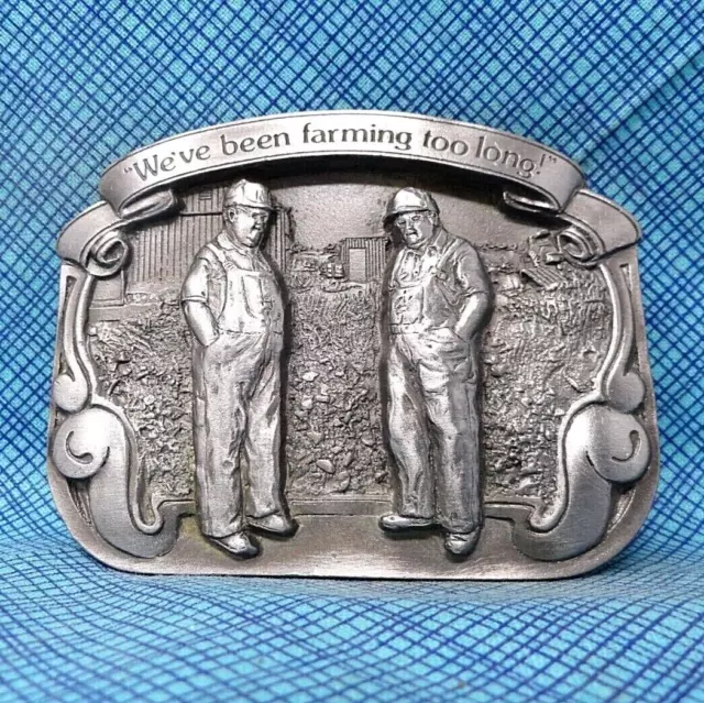 We've Been Farming Too Long Belt Buckle - Vintage 1989 Reiman            .DBD739