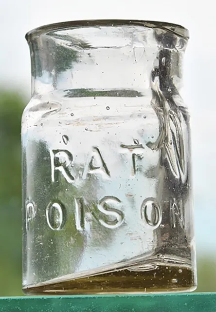 Tiny Wide Mouth Jar Embossed on the Front ‘RAT POISON”, clear glass