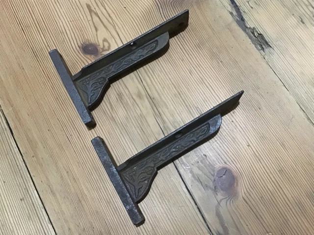 Pair of old industrial cast iron  shelf brackets.small fancy shelf brackets