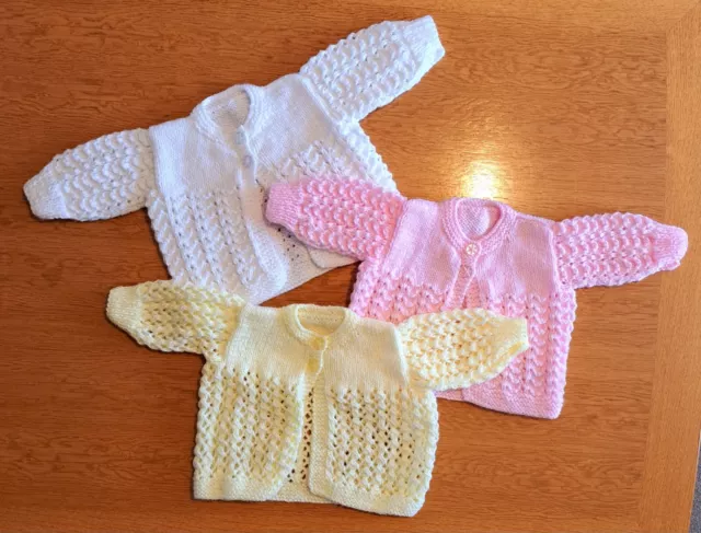 Three NEW baby knitted cardigans, white, lemon and pink 0-3 months 