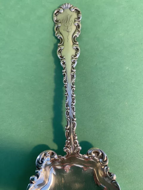 Whiting Mnfg.  Louis XV  (1891) Sterling Silver. Serving Spoon. . Mono “ ML”. 8” 3