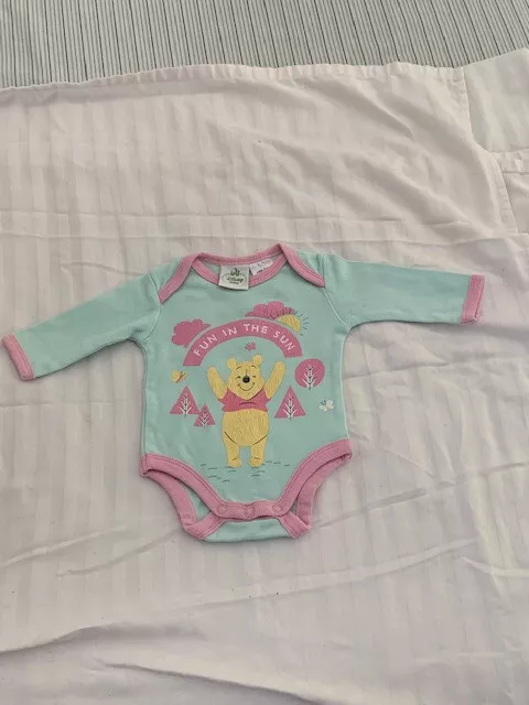 ‘Disney baby’ Long sleeved cotton all in one in Size 0000 with Winnie the Pooh l