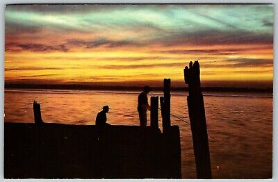 Man Fishing From Pier, Sunset Over the Waters, MI - Postcard