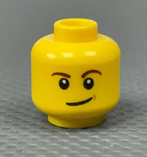 LEGO Minifigure Head Reddish Brown Eyebrows White Pupils Lopsided Smile Dimple