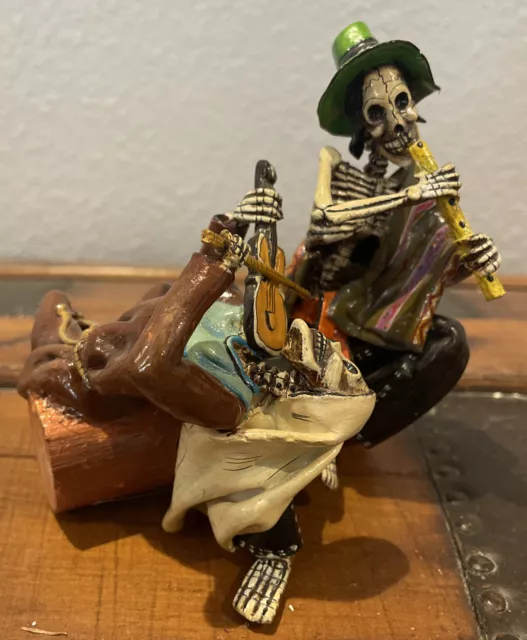 Claudio Jimenez Day of the Dead Skeleton Musician Couple On A Log