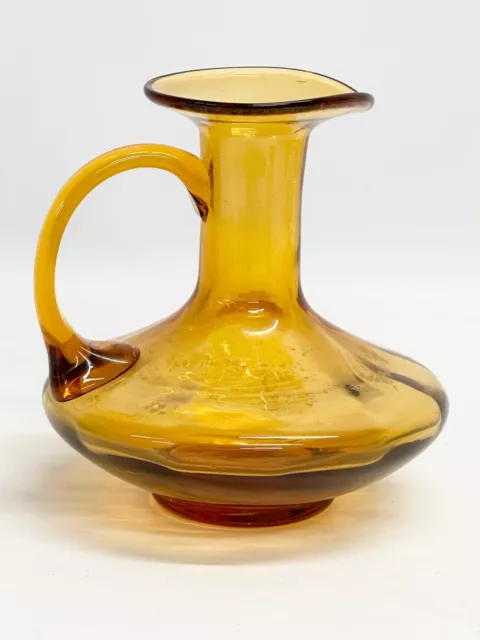 An early 19th century Amber Glass jug. Circa 1800-1830. 17x16x16cm