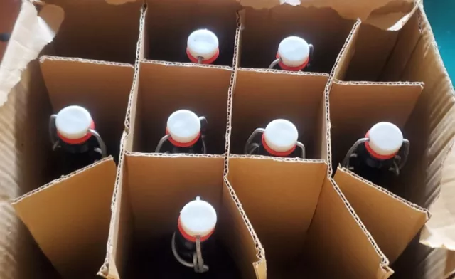 Seven (7) EZ Cap Swing Top Amber 16oz Bottles In Orignial Case
