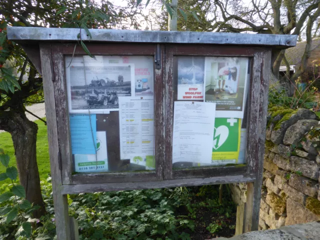 Photo 12x8 Village noticeboard Clipsham In the garden of the house that us c2014