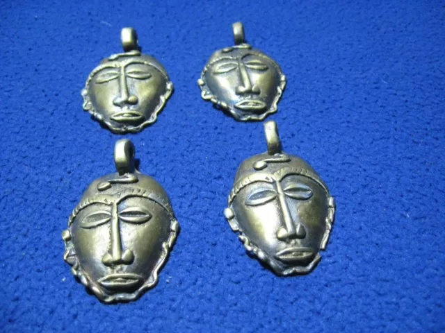 African ? FACE Mask Pendant Decorative METAL _ (4 pcs) _ used _ g/cond.    IV
