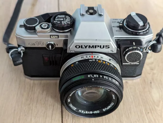 Excellent Olympus OM10 35mm SLR Camera + Zuiko 50mm f1.8 Lens + Case + Strap