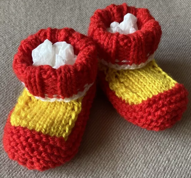 Baby Booties/Sockettes.  Gold Coast Suns Colours. Hand-knitted by me. Newborn.