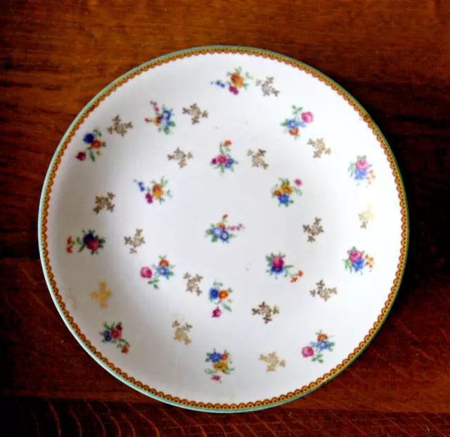 Ancien plat rond piedouche en porcelaine de Limoges Raynaud Décor petites fleurs 3