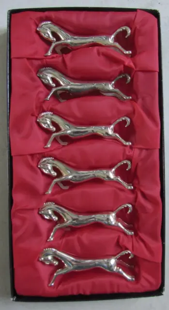Ensemble de 6 porte-couteaux chevaux en métal argenté origine Galeries Lafayette