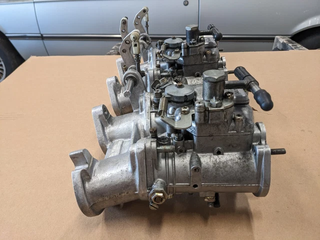 Pair Of 44 mm Mikuni carburetors with manifold, linkage from BMW M10 engine