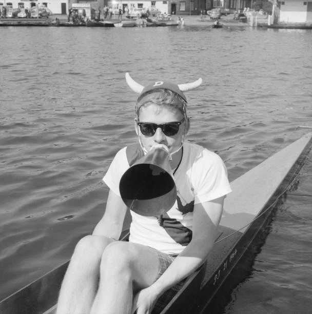 THE COX A Harvard rowing crew wearing unusual University hat ca 1964