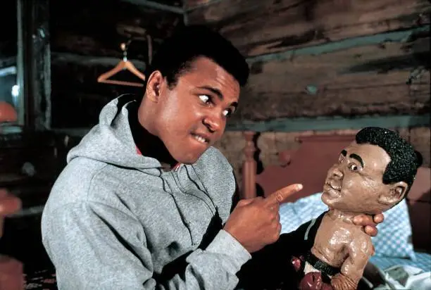 Muhammad Ali with doll or toy of his likeness during photo s - 1974 Old Photo