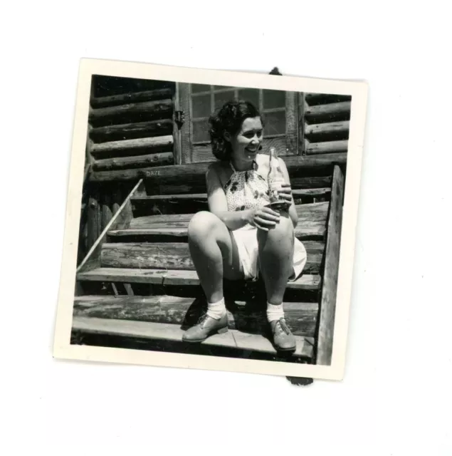 Vintage snapshot  photo woman drinking vintage O'Keefe's  Old Vienna beer