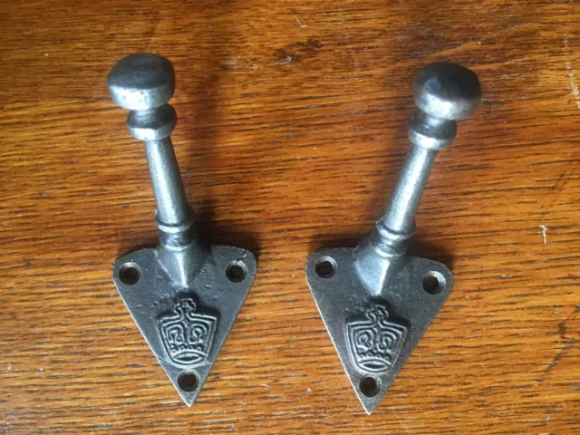A pair of Ministry crown coathook coat hook cast iron hanger
