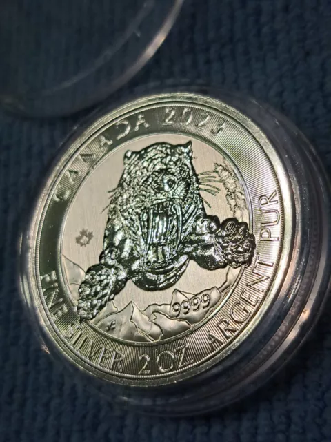 2 oz Silver Coin Canadian Smilodon Sabretooth Tiger BU (2023)