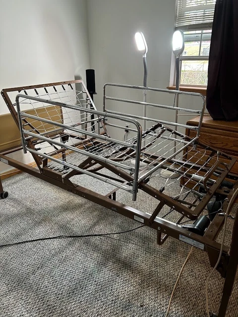 Hospital Bed electric and hand crank operated.  No mattress.  Side rails adjust.