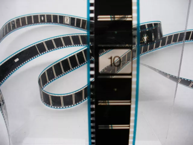 35mm  CINEMA TRAILERS, INCLUDES 10 TITLES AND  PLASTIC 2000ft FILM CASE.