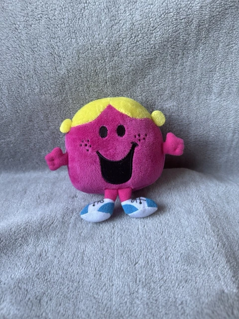 a soft plush toy reminiscent of the elton john rocket man era, with a character that resembles an astronaut, symbolizing the rocket man's journey to the stars