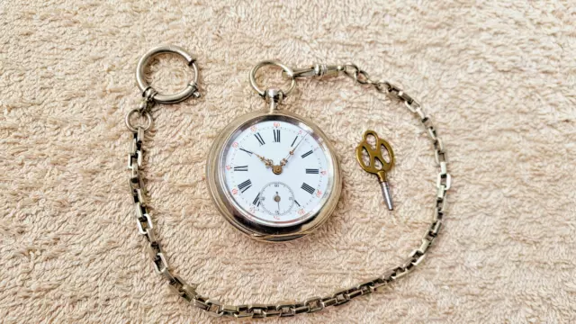 Antico orologio da tasca anni Fondamentali ascensore a chiave del 1880 con catena Pocket Watch orologio