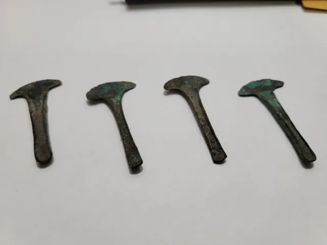 (4) Aztec Axe Money Each Approximately 1.75 Inches In Length