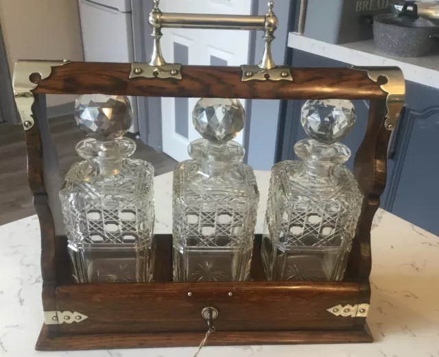 A  Lovely Edwardian Antique Three Bottle, Oak Tantalus With Key Circa 1900.