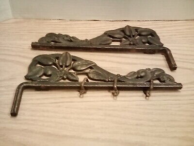 Two Vintage Cast Iron Decorative Curtain Rod Holders.