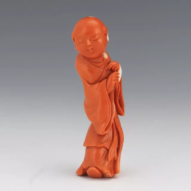 An Excellent Carved Chinese Qing Dynasty Coral Figurine of a Boy.