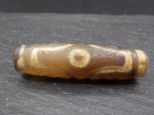An Agate Dzi bead with a 6 Eye pattern from Tibet / Nepal. Tibetan Dzi Bead.