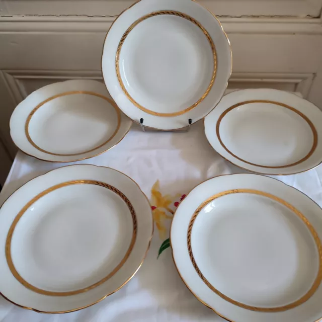 Cinq  assiettes creuses filets dorés en porcelaine Larcheveque UML Vierzon