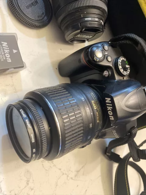 Nikon D3000 10.2MP Digital SLR Camera w/AF-S DX Nikkor 18-55mm AND 55-200mm Lens