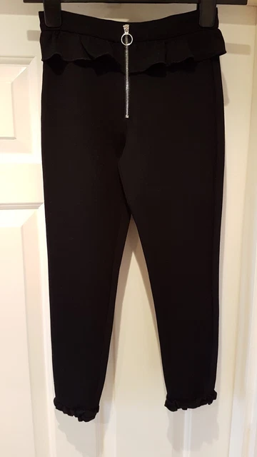 Bellissimi pantaloni anteriori River Island cerniera colore nero età 9/10 anni