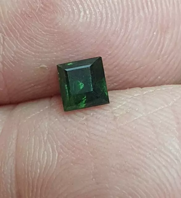 Natural Australian earth-mined rich green princess cut sapphire..0.9 carat