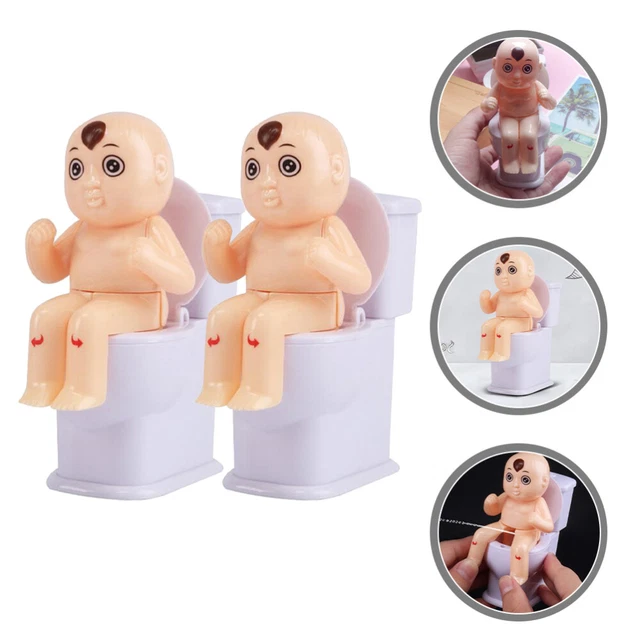 2 piezas Squirt Peeing juguete de muñeca agua en juguete de inodoro Cessel St