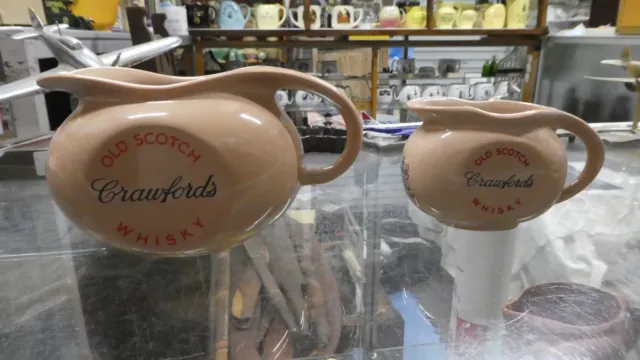 https://www.picclickimg.com/aTwAAOSwiRVlmjHl/Vintage-Graduated-Crawfords-Old-Scotch-Whisky-Water-Jugs.webp
