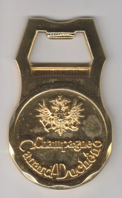 un décapsuleur doré champagne Canard-Duchêne JO 68 jeux olympiques