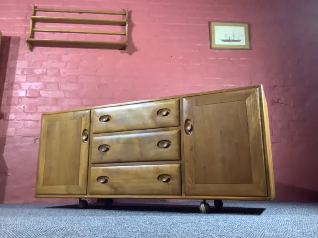 Ercol Windsor 455 Sideboard On Castors In Original Natural Elm Finish.