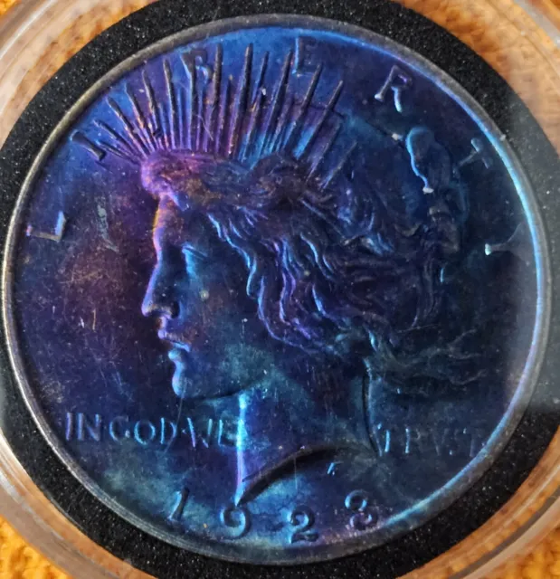 1923 $1 Peace Dollar Artificialally Toned In Capsule.