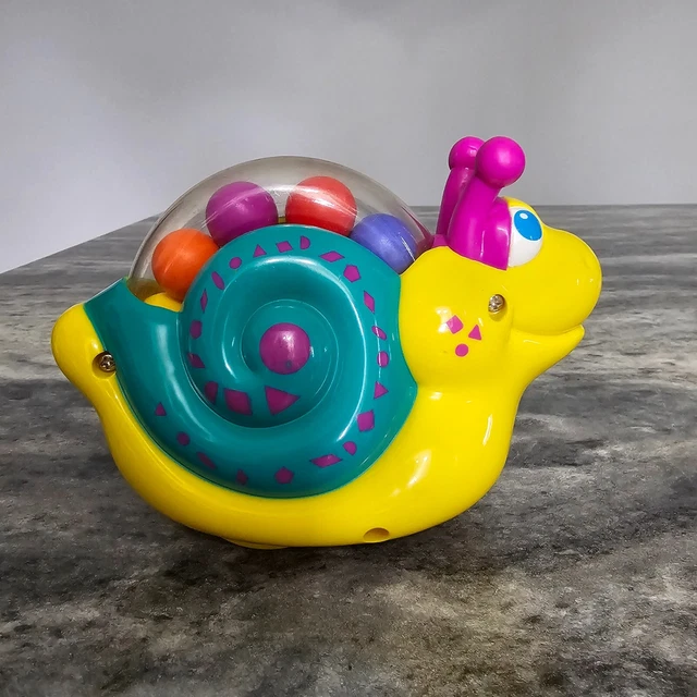 VINTAGE SHELCORE ROLL-ALONG Snail Child Toy 1997 Rolling Rainbow of ...