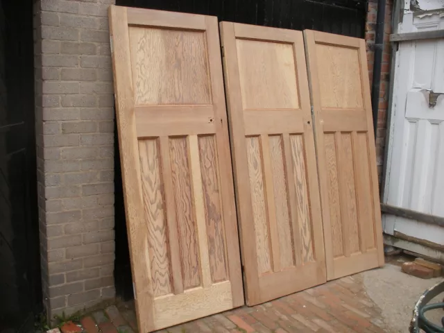 Reclaimed 1930s 1 over 3 panel stripped pine doors.