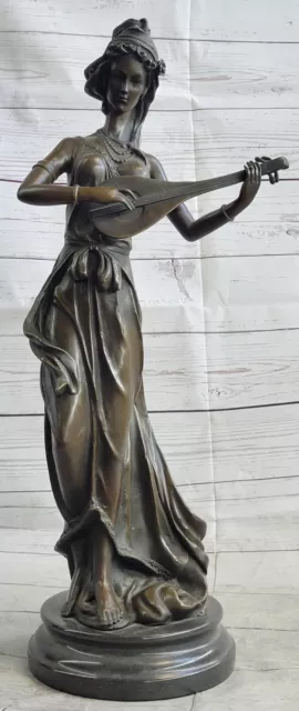 Artful Harmony Bronze Sculpture by Jean La Representing a Female Banjo Player